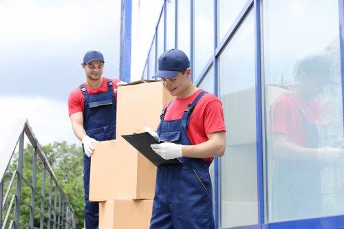 Local team handling furniture removal from a Belmont apartment building