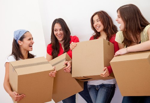 Loading furniture and boxes into a moving van for a Belmont move