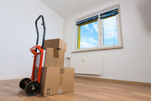 Prepared boxes and furniture ready for a Belmont moving van service